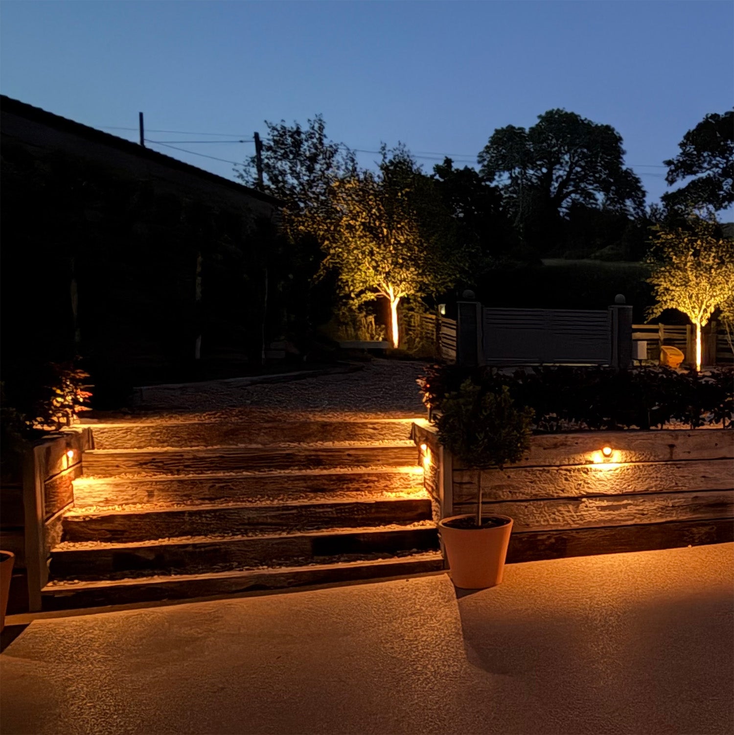 Hunza Mouse Light insitue image showing pools of light cast over a driveway and steps