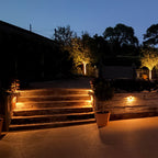 Hunza Mouse Light insitue image showing pools of light cast over a driveway and steps